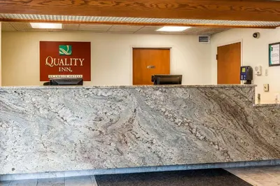 an empty lobby with a marble counter top in a office at Quality Inn Jackson in Jackson