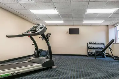 a gym with an exercise bike and a treadmill at Quality Inn Jackson in Jackson