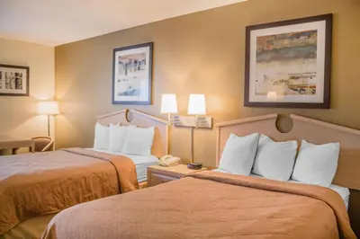 a hotel room with two beds and two lamps at Quality Inn Port Clinton Waterfront in Port Clinton