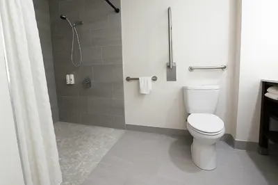 a bathroom with a toilet and a shower at Quality Inn & Suites Circleville in Circleville