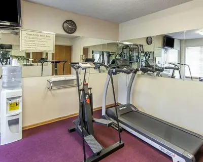 a gym with a treadmill and a mirror at Quality Inn & Suites Circleville in Circleville