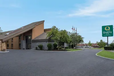 a building with a sign in front of it at Quality Inn Toledo Westgate in Toledo