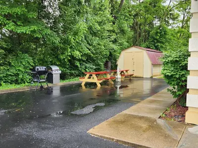 a picnic table in the rain on a driveway at Quality Inn Wheelersburg in Wheelersburg