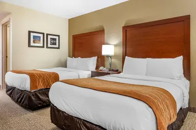 a hotel room with two beds in a room at Comfort Inn Cincinnati Northeast in Mason