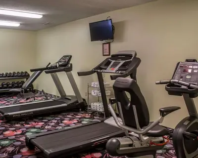 a fitness room with treadmill machines and a tv at Sleep Inn Sandusky in Sandusky