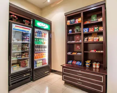 a store with an open refrigerator with food in it at Comfort Suites Troy-I75 in Troy