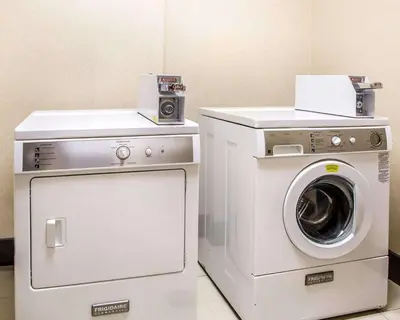 a washer and dryer in a room at Comfort Suites Troy-I75 in Troy