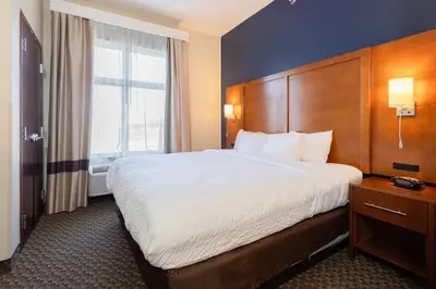 a hotel room with a large bed and a window at Comfort Suites Troy-I75 in Troy
