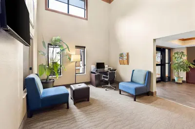 a waiting room with two chairs and a desk at Comfort Inn Van Wert in Van Wert
