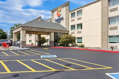 a hotel parking lot in front of a building at Comfort Inn Mayfield Heights Cleveland East in Mayfield