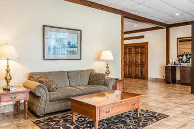 a living room with a couch and a coffee table at Quality Inn Gallipolis in Gallipolis