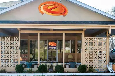 a fast food restaurant with a sign on the front of it at Economy Inn & Suites in Warren