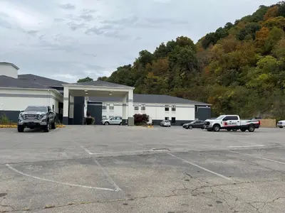 a parking lot in front of a building at Quality Inn & Suites Portsmouth in Rosemount