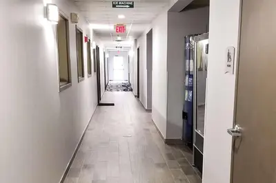 a corridor of an office with a long hallway at Quality Inn & Suites Cincinnati Sharonville in Sharonville
