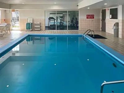 a large pool with blue water in a gym at Quality Inn & Suites Cincinnati Sharonville in Sharonville