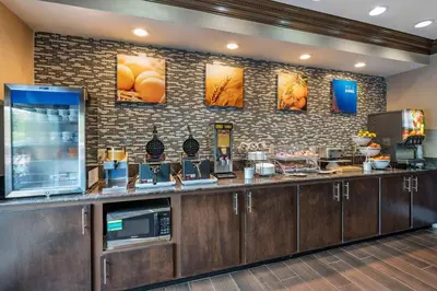 a fast food counter in a restaurant with a counter at Comfort Inn & Suites Cincinnati Uptown Clifton in Cincinnati
