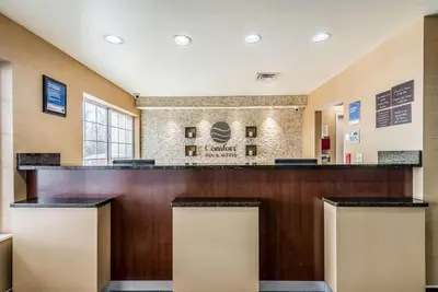 a large lobby with a bar in a hotel at Comfort Inn & Suites Dayton North in Dayton