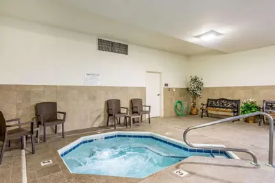 a jacuzzi tub in a waiting room with chairs at Comfort Inn & Suites Dayton North in Dayton