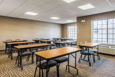 a classroom with tables and chairs in a room at Comfort Inn & Suites Dayton North in Dayton