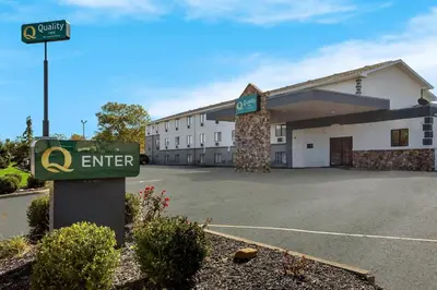 a hotel with a sign in front of a building at Quality Inn Hall of Fame in Canton
