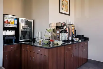 a kitchen with a counter with a coffee maker at Quality Inn Hall of Fame in Canton