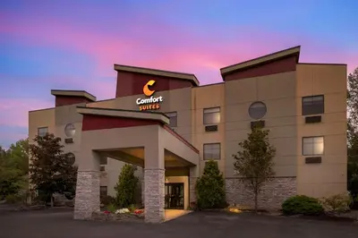 a hotel with a sign on the front of it at Comfort Suites Monaca in Monaca