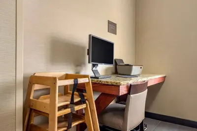 a desk with a computer on top of it at Comfort Inn Meadowlands in Washington