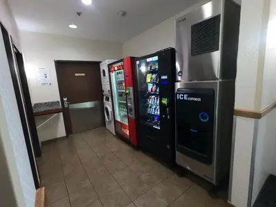 two vending machines are in a room with a hallway at HomeTowne Studios & Suites by Red Roof Washington in Washington