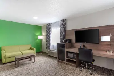 a living room with a couch and a television at Quality Inn Ripley in Ripley