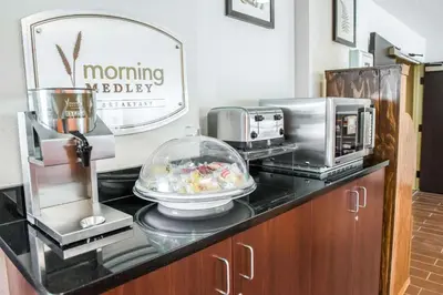 a counter with a coffee maker and a microwave at Quality Inn Bridgeport-Clarksburg in Bridgeport