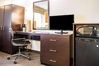 an office with a desk with a television and a chair at Quality Inn Bridgeport-Clarksburg in Bridgeport