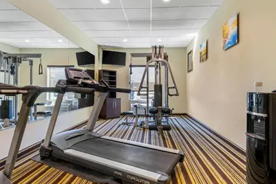 a gym with two treadmills and a treadmill at Comfort Inn & Suites Triadelphia - Wheeling in Triadelphia