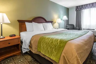 a hotel room with a large bed and a window at Comfort Inn Weirton - Steubenville in Weirton