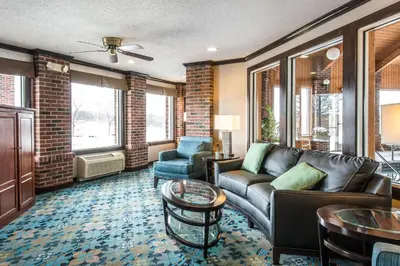 a living room with a couch and a table at Comfort Inn Weirton - Steubenville in Weirton