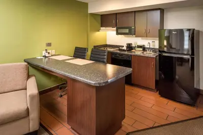 a kitchen with a large island in a room at Sleep Inn Charleston North in Charleston