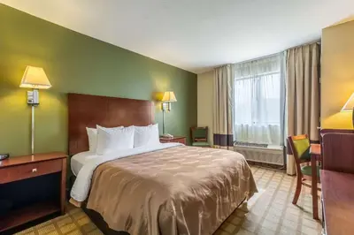 a hotel room with a bed and a window at Quality Inn I-74 Batesville in Batesville