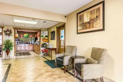 a waiting room with chairs and a table at Quality Inn I-74 Batesville in Batesville