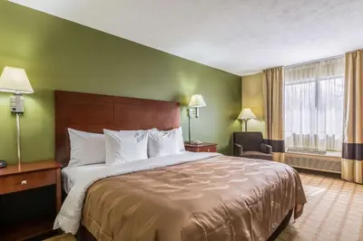 a hotel room with a large bed and a window at Quality Inn I-74 Batesville in Batesville