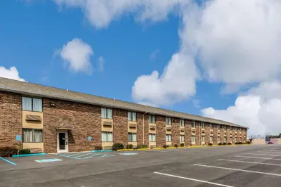 an empty parking lot in front of a brick building at Quality Inn I-74 Batesville in Batesville