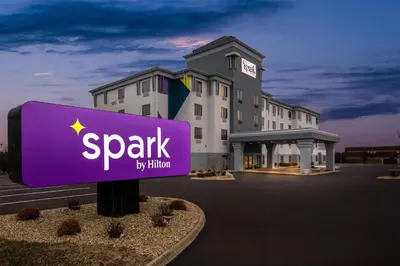 a purple sign in front of a building at Spark by Hilton Cincinnati Fairfield in Forest Park