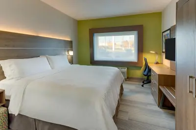 a hotel room with a large bed and a window at Holiday Inn Express - Cincinnati North - Monroe by IHG in Monroe
