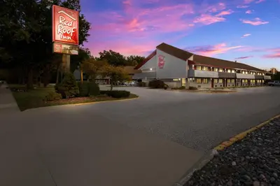a building with a sign in front of a motel at Red Roof Inn Cleveland - Westlake in Westlake