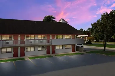 a building with a parking lot in front of it at Red Roof Inn Cleveland - Westlake in Westlake