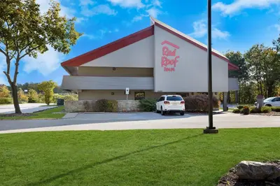 a car parked in front of a red roof inn at Red Roof Inn Cleveland - Westlake in Westlake