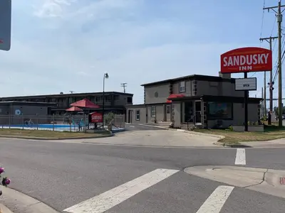an empty street in front of a sandwich shop at Sandusky Inn in Sandusky