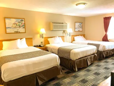 a hotel room with two beds in it at Sandusky Inn in Sandusky