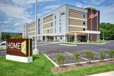 a building with a home hotel sign in front of it at Home2 Suites By Hilton Georgetown in Georgetown