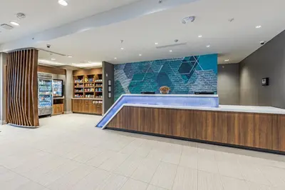 a lobby with a basketball court on the wall at SpringHill Suites by Marriott Fort Wayne North in Sunnybrook Acres