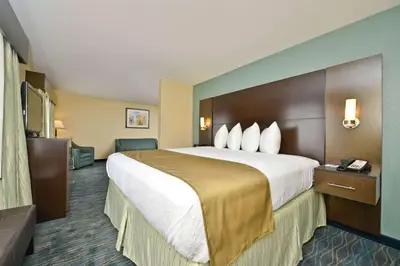 a hotel room with a large bed in it at Baymont by Wyndham Marion, OH in Marion