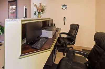an office with a desk with a computer and a chair at Baymont by Wyndham Marion, OH in Marion